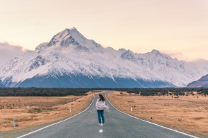 Captivating image of Bianca embracing the wind on the road to Mount Cook/Aoraki National Park - A must-visit destination for nature enthusiasts. Discover the breathtaking landscapes and adventure awaits!