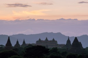 Mesmerizing Bagan Sunrise Over Pagodas - Still Morning Bliss | Capture the serenity as the sun paints pastel hues over iconic Bagan pagodas. A tranquil sunrise, perfect for wanderlust-filled moments.