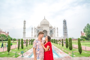 Bianca and Brett posing at Taj Mahal, iconic monument backdrop